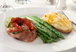 Juicy flank steak roll with spinach, carrots and red peppers